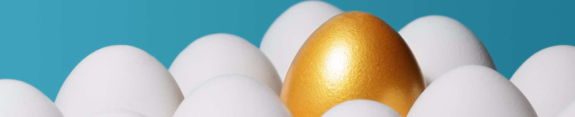 gold egg amongst white eggs