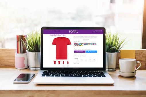 total clothing laptop showing design and buy